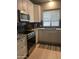 Well-equipped kitchen featuring stainless steel appliances, including a microwave and electric range, with ample counter space at 4242 N 27Th St # 2, Phoenix, AZ 85016