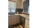Granite countertops complement the stainless steel dishwasher and sink in this bright and functional kitchen at 4242 N 27Th St # 2, Phoenix, AZ 85016