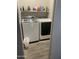 A compact laundry room showcases a Samsung washer and dryer and handy shelving with cleaning supplies at 4242 N 27Th St # 2, Phoenix, AZ 85016