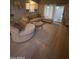Bright living room featuring a comfortable sectional sofa, light wood floors, and access to an outdoor patio at 4242 N 27Th St # 2, Phoenix, AZ 85016