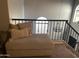 Loft area with comfortable seating, iron railing, and arched window, perfect for relaxation at 4242 N 27Th St # 2, Phoenix, AZ 85016