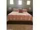 Cozy main bedroom featuring a comfortable bed with decorative pillows and matching nightstands at 4242 N 27Th St # 2, Phoenix, AZ 85016