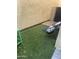 Outdoor space with artificial grass and modern black metal chairs for relaxing and enjoying the fresh air at 4242 N 27Th St # 2, Phoenix, AZ 85016