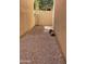 Narrow side yard featuring gravel groundcover and a young tree against block wall at 4242 N 27Th St # 2, Phoenix, AZ 85016
