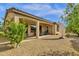 Charming home exterior showcasing a covered patio and landscaped backyard at 4249 E Nightingale Ln, Gilbert, AZ 85298