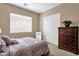 Comfortable bedroom with carpet flooring, closet, and ample natural light at 4249 E Nightingale Ln, Gilbert, AZ 85298