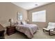 Bedroom with carpet, a large window, and relaxing sitting area at 4249 E Nightingale Ln, Gilbert, AZ 85298