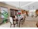Elegant dining room featuring a chandelier, beautiful table setting, and a classic china cabinet at 4249 E Nightingale Ln, Gilbert, AZ 85298