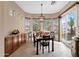 Bright dining area with abundant natural light, stylish furniture, and easy access to outdoor spaces at 4249 E Nightingale Ln, Gilbert, AZ 85298