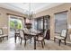 Charming dining room with access to the outdoor area, complemented by a stylish china cabinet at 4249 E Nightingale Ln, Gilbert, AZ 85298