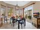 Comfortable dining area with a modern chandelier, cozy setting, and a smooth transition to the outdoors at 4249 E Nightingale Ln, Gilbert, AZ 85298
