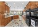 Gourmet kitchen with modern appliances, custom cabinetry, and an open layout ideal for entertaining guests at 4249 E Nightingale Ln, Gilbert, AZ 85298