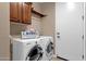Well-equipped laundry room with modern washer and dryer for convenience at 4249 E Nightingale Ln, Gilbert, AZ 85298