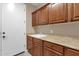 Functional laundry room with ample counter space, storage cabinets, and sink at 4249 E Nightingale Ln, Gilbert, AZ 85298