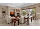 Inviting living room showcasing a fireplace, comfortable seating, and natural light with backyard views at 4249 E Nightingale Ln, Gilbert, AZ 85298