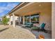 Covered patio with seating, providing an ideal space for outdoor relaxation at 4249 E Nightingale Ln, Gilbert, AZ 85298