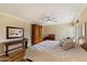 Spacious bedroom featuring light walls, a brick accent wall and lots of natural light at 4800 N 68Th St # 270, Scottsdale, AZ 85251