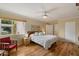 Bright bedroom with hardwood floors, a ceiling fan, and a window view at 4800 N 68Th St # 270, Scottsdale, AZ 85251