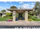 Elegant entrance with vibrant flowers, lush greenery, and a well-maintained walkway at 4800 N 68Th St # 270, Scottsdale, AZ 85251