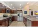 Modern kitchen with stainless steel appliances, granite countertops, and ample cabinet space at 4800 N 68Th St # 270, Scottsdale, AZ 85251