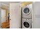 A convenient, stacked washer and dryer set are featured in the laundry area at 4800 N 68Th St # 270, Scottsdale, AZ 85251