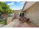 Cozy brick patio with a table and chairs, perfect for enjoying outdoor living and dining at 4800 N 68Th St # 270, Scottsdale, AZ 85251