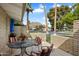 Relax on this patio with a table and chairs, enjoying views of the community and palm trees at 4800 N 68Th St # 270, Scottsdale, AZ 85251