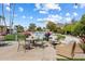 Inviting pool area surrounded by green grass, tables, chairs, and comfortable outdoor seating at 4800 N 68Th St # 270, Scottsdale, AZ 85251