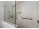 Accessible shower with grab bars and glass enclosure for safety and convenience at 4800 N 68Th St # 270, Scottsdale, AZ 85251