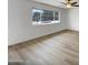 Bedroom with a ceiling fan and large window with view of front yard and neighborhood at 492 W 17Th Ave, Apache Junction, AZ 85120