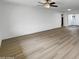 Large, bright living room with light-colored walls and vinyl floors at 492 W 17Th Ave, Apache Junction, AZ 85120