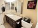 A bathroom featuring granite countertop, tile flooring, and framed decor on the wall at 4925 E Desert Cove Ave # 236, Scottsdale, AZ 85254