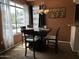 Dining room featuring a modern chandelier and large window letting in natural light at 4925 E Desert Cove Ave # 236, Scottsdale, AZ 85254
