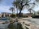 Gated community entrance with water feature and signage surrounded by palm trees at 4925 E Desert Cove Ave # 236, Scottsdale, AZ 85254