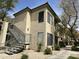 Exterior view of condo building with staircase, desert landscaping and neutral paint at 4925 E Desert Cove Ave # 236, Scottsdale, AZ 85254