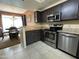 Bright open kitchen featuring stainless steel appliances and adjacent dining area at 4925 E Desert Cove Ave # 236, Scottsdale, AZ 85254