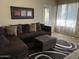 Comfortable living room featuring a large window and a plush sectional sofa at 4925 E Desert Cove Ave # 236, Scottsdale, AZ 85254