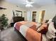 Comfortable bedroom with a ceiling fan, dresser and access to closet and en suite bath at 4925 E Desert Cove Ave # 236, Scottsdale, AZ 85254