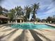 Community pool with palm trees, a gazebo, and lounge chairs for residents to relax at 4925 E Desert Cove Ave # 236, Scottsdale, AZ 85254
