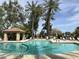 Inviting community swimming pool with palm trees and ample seating for residents at 4925 E Desert Cove Ave # 236, Scottsdale, AZ 85254