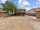 Spacious backyard that includes covered patio and gravel landscaping, ready for your personal touch at 540 W Palo Verde St, Casa Grande, AZ 85122