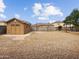 Large backyard area, featuring gravel, shed, and privacy walls at 540 W Palo Verde St, Casa Grande, AZ 85122