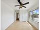 Bedroom with laminate flooring, ceiling fan, and a sun-lit window at 540 W Palo Verde St, Casa Grande, AZ 85122