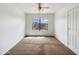 Bedroom with a window, carpet, and ceiling fan at 540 W Palo Verde St, Casa Grande, AZ 85122