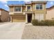 Two-story home with a well-maintained front yard and neutral-colored exterior at 540 W Palo Verde St, Casa Grande, AZ 85122