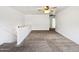 Carpeted loft area with a ceiling fan and staircase access at 540 W Palo Verde St, Casa Grande, AZ 85122