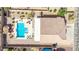 Aerial view of backyard with pool, lounge area, and covered patio at 565 E Rosebud Dr, San Tan Valley, AZ 85143