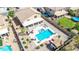 A luxurious backyard includes an inviting pool, lounge areas, and covered patio at 565 E Rosebud Dr, San Tan Valley, AZ 85143