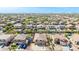 Bird's eye view of a neighborhood featuring homes with backyard pools and mountain views at 565 E Rosebud Dr, San Tan Valley, AZ 85143