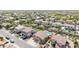 Aerial view of a community with mature trees, backyard pools, and well-maintained landscaping at 565 E Rosebud Dr, San Tan Valley, AZ 85143